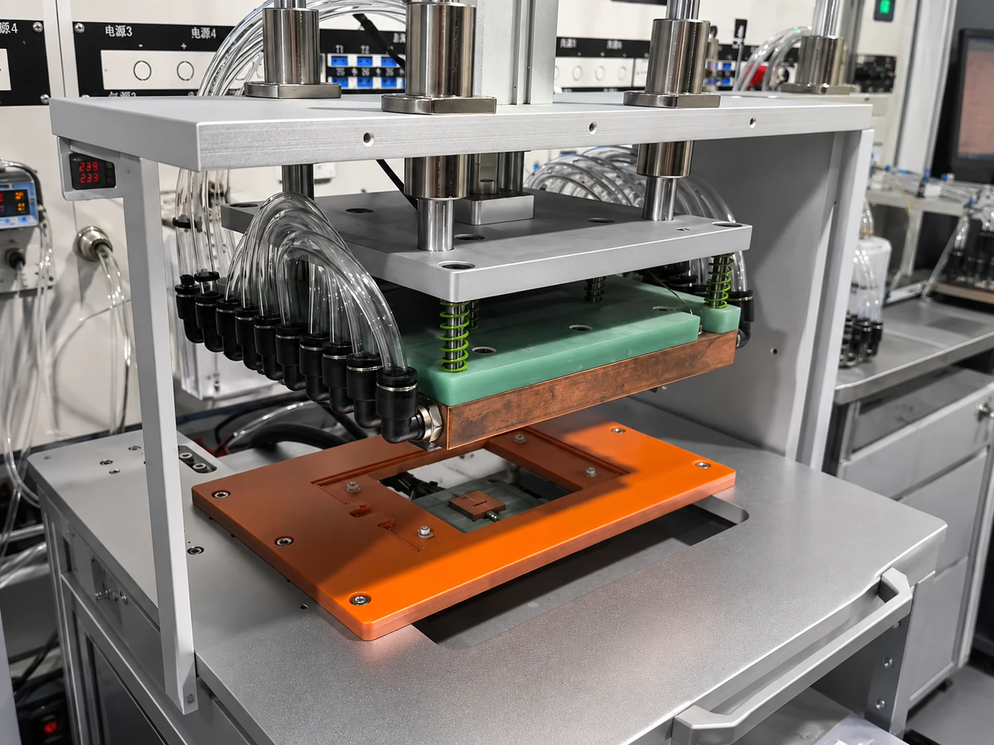 Automated thermal test fixture with clamping plate and liquid-cooling manifold